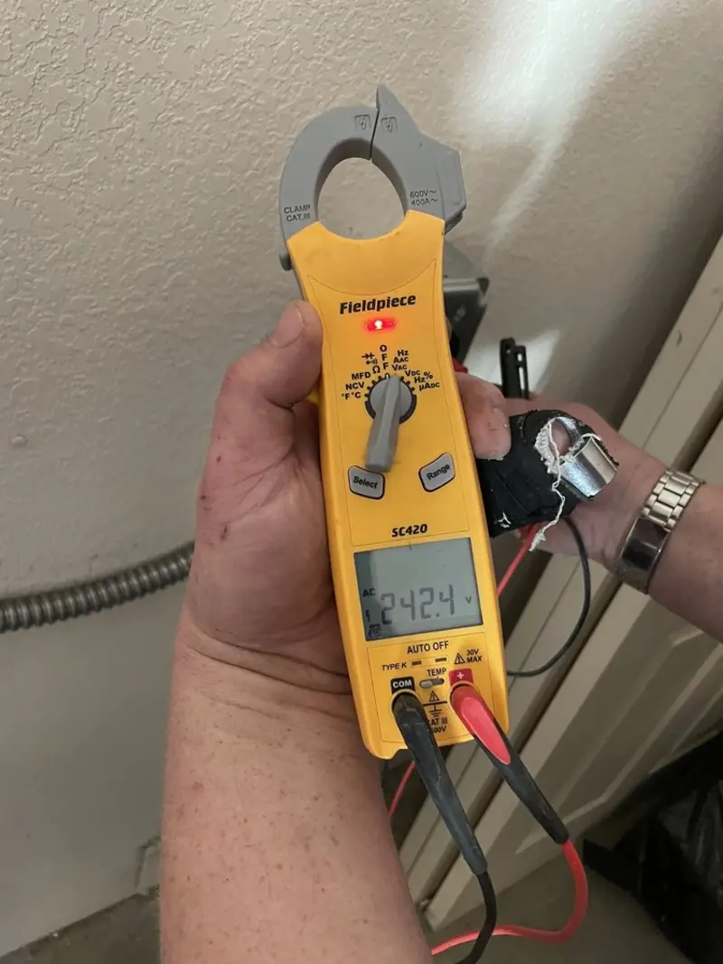 Voltage testing with clamp meter during Recessed Lighting Installation in Lemont
